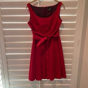 Red dress purchased at Anthropologie, although the name is Viola. 100% cotton.